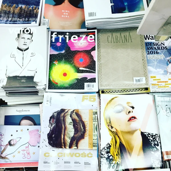 Art and design magazines arranged on a bookshop display.